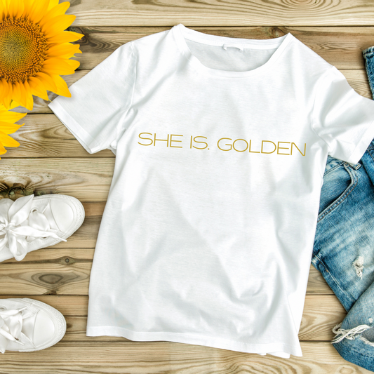 SHE IS. GOLDEN Tee